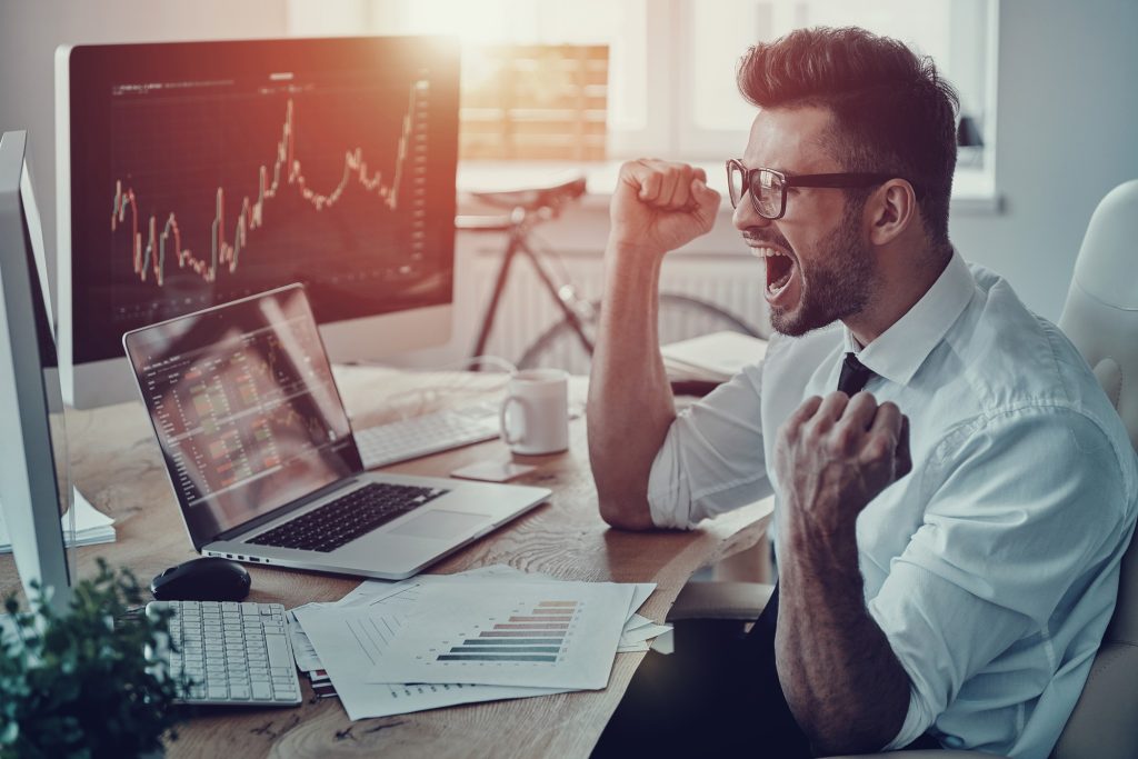unbelievable-growth-happy-young-businessman-formalwear-shouting-gesturing-while-using-computer-office-1024x683.jpg